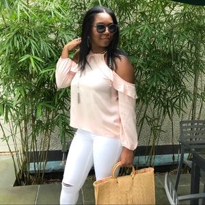 Flowing ruffle cold shoulder top.